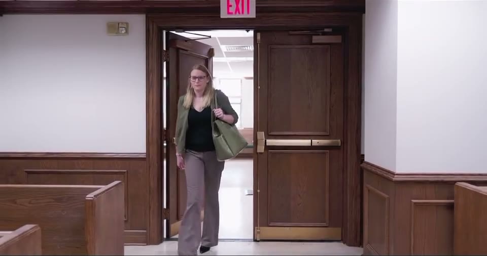 Colleen leaving a courtroom